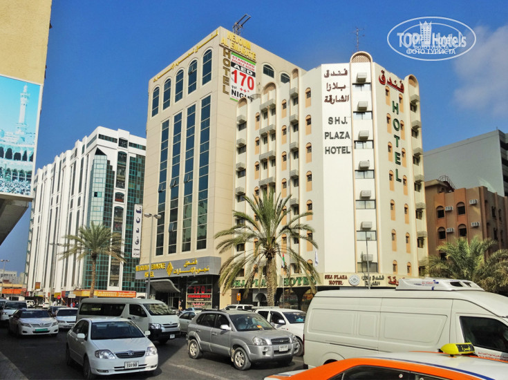 Nejoum Al Emarat 3* В середине, между двумя зданиями пониже, с красными цифрами 170, - отель Ниджум аль Эмарат. - Фото отеля