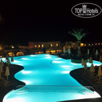 Grecotel Marine Palace & Aqua Park 4* Главный бассейн вечером - Фото отеля