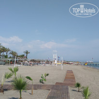 Aydinbey Famous Resort 5* Вид на пляж с территории другого отеля - Фото отеля