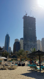 Le Royal Meridien Beach Resort & Spa 5* Строящиеся здание рядом с Меридианом, вид с пляжа. Слева Башня Кинг тауэре, выглядит совсем крошечной. - Фото отеля