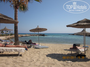 Adams Beach 5* вид на пляж бухточку и пляж из от таверны - Фото отеля