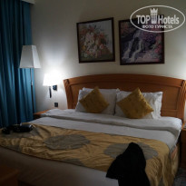 Golden Tulip Sharjah 4* Кровать в номере - Фото отеля